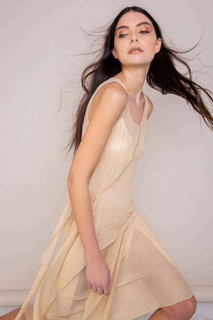 Model wearing Barbara Silk Dress in loose style showing versatile styling options in side view