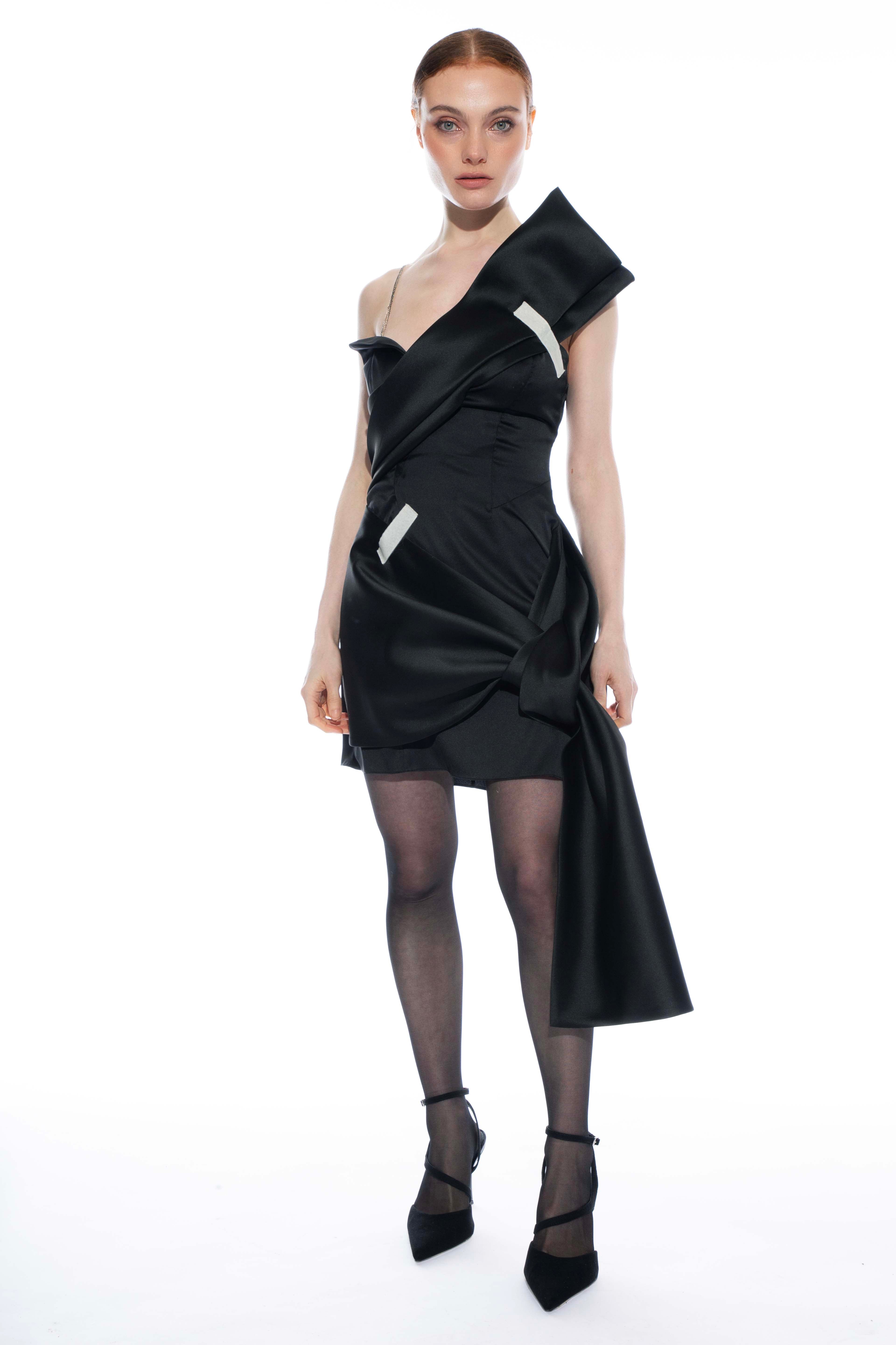 Janet black wrap mini dress styled for evening wear - model showcasing the dress's versatility by ByVarga