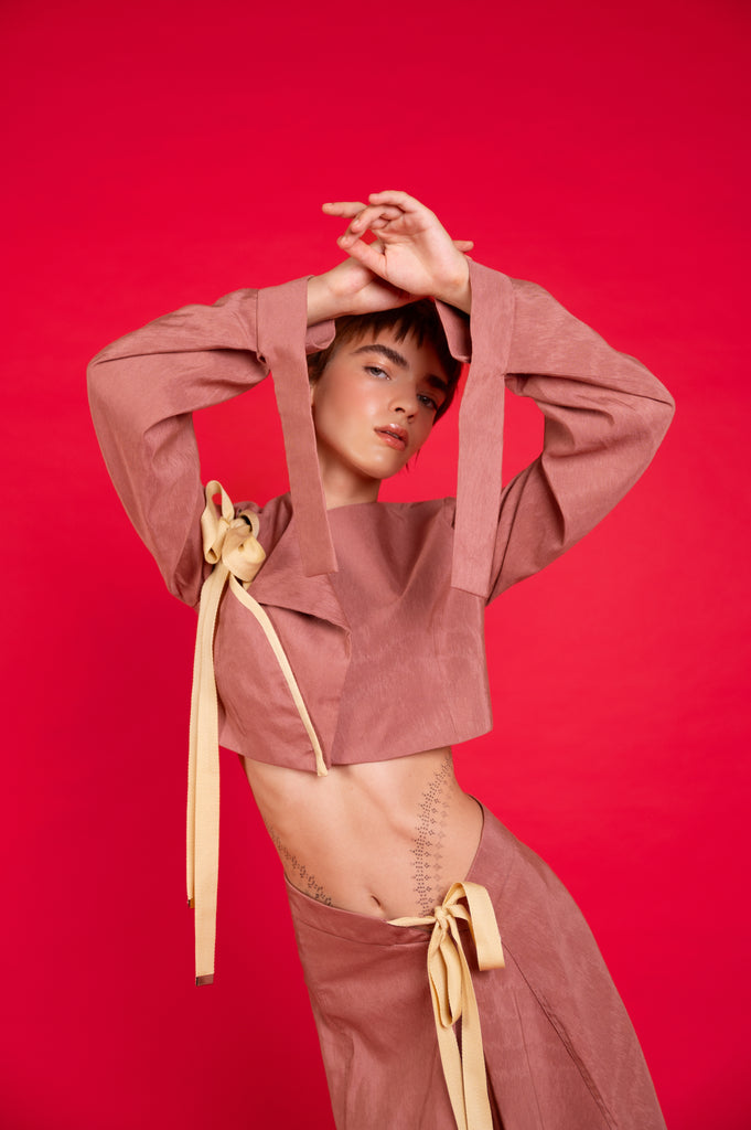 Model wearing Zara Cropped Jacket in antique rose colour front view,