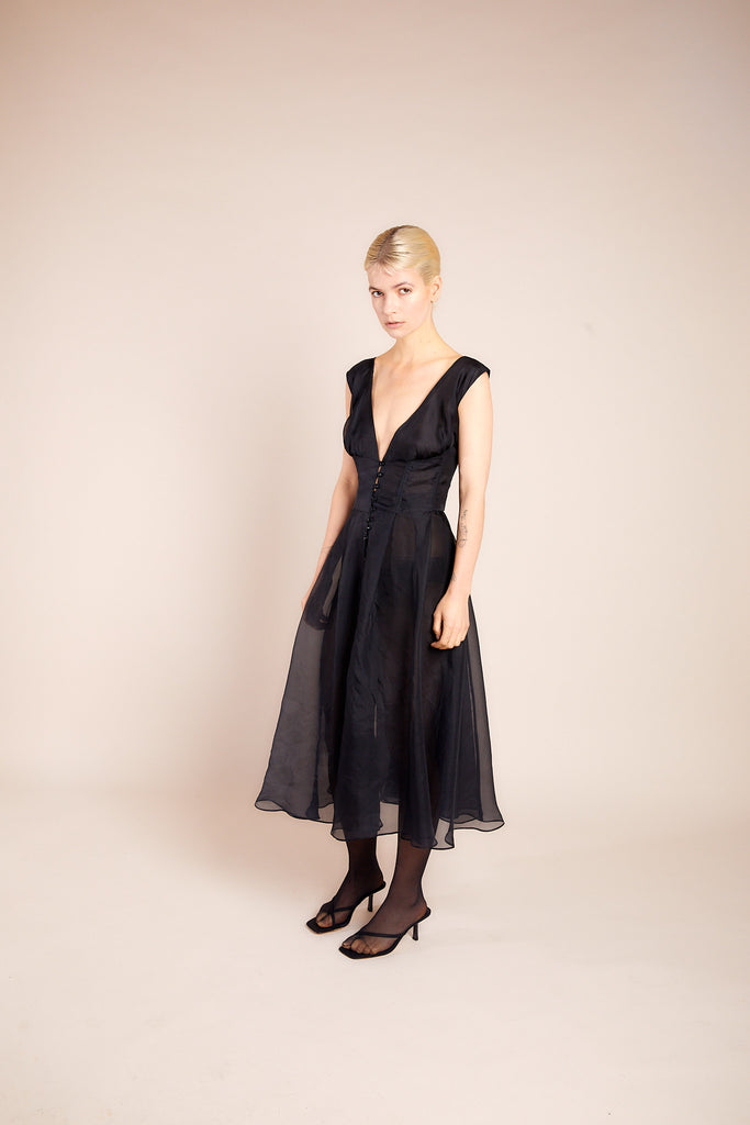 Model wearing Monic Organza Silk Dress in elegant pose, front view, showcasing luxurious silk fabric and intricate details by ByVarga
